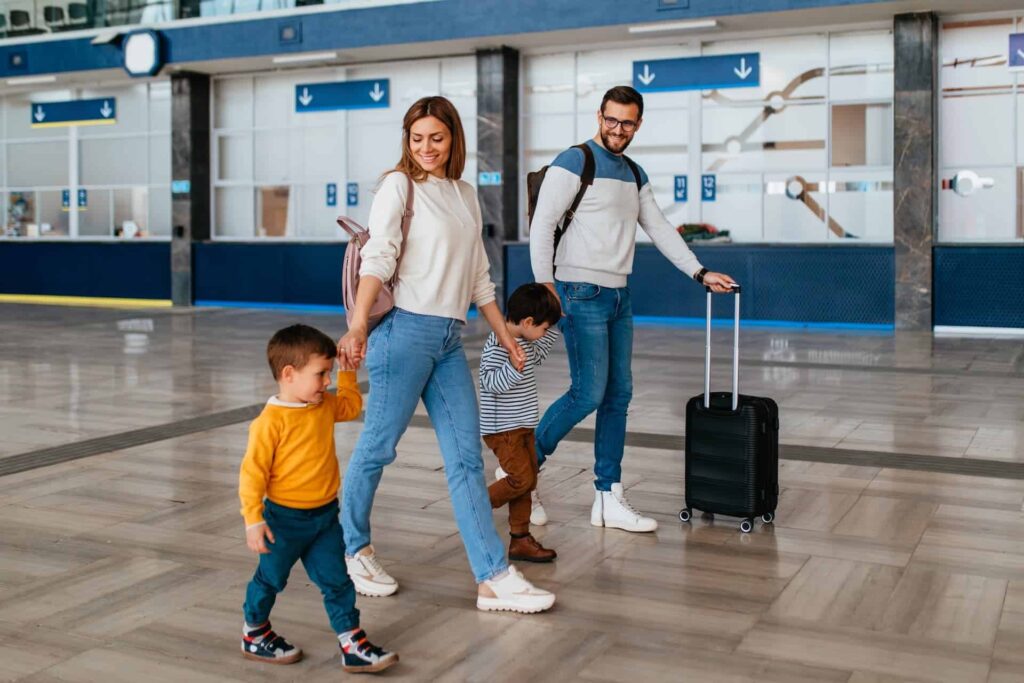 Family walking along a train platform